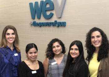 WEV staff members gather for the open house.
