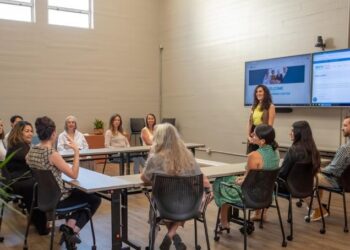 Irene Kelly, WEV’s Financial Education Manager, discusses financial empowerment with a class