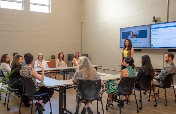 Irene Kelly, WEV’s Financial Education Manager, discusses financial empowerment with a class