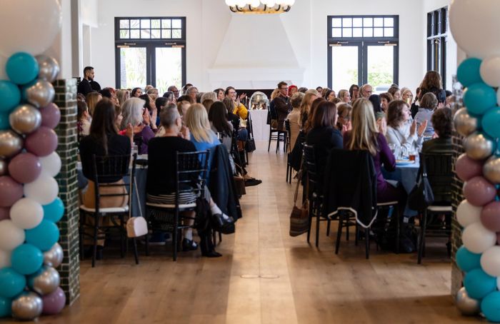 Attendees of WEV's International Women's Day Event seated at tables.